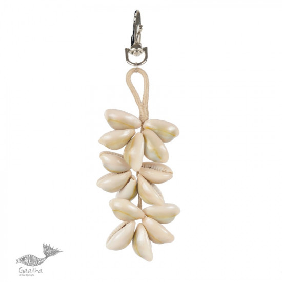 shop online handmade cowrie jute hand bag charm / key chain