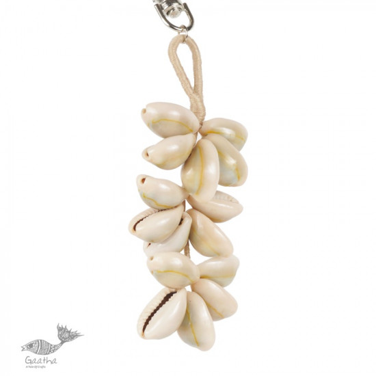 shop online handmade cowrie jute hand bag charm / key chain