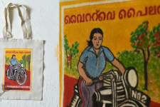 Carnival on Canvas | Matchbox Label Painted on Canvas Bag - Lady & Bike