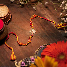 Dhokra Brass ❂ Handmade Rakhi - Red & Yellow Thread