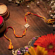 shop handmade dhokra brass rakhi  Red & Yellow Thread