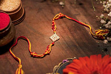 Dhokra Brass ❂ Handmade Rakhi - Red & Yellow Thread