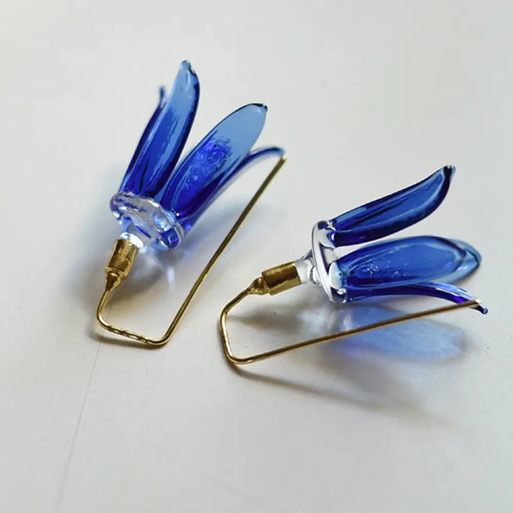 handcrafted cobalt blue lampwork glass floral bell drop earrings with brass hook wire in vibrant translucent finish