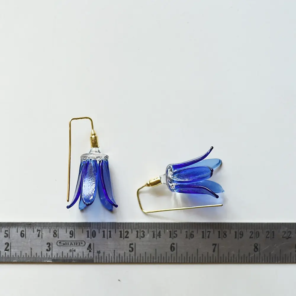 handcrafted cobalt blue lampwork glass floral bell drop earrings with brass hook wire in vibrant translucent finish