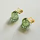 handcrafted sage green glass drop earrings featuring a bell blossom and orb dangle with brass geometric stud tops