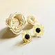 handcrafted translucent amber yellow glass bloom stud earrings with a dark textured center cap on brass post backs