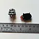 handcrafted black and white polka dot ladybug lampwork glass stud earrings named polka bug with red head accents   