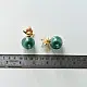 handcrafted deep emerald green glass orb stud earrings crowned with a lotus bud top on brass posts
