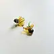 handcrafted translucent amber yellow glass sunflower stud earrings featuring a textured dark beaded center cap