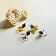 handcrafted translucent amber yellow glass sunflower stud earrings featuring a textured dark beaded center cap