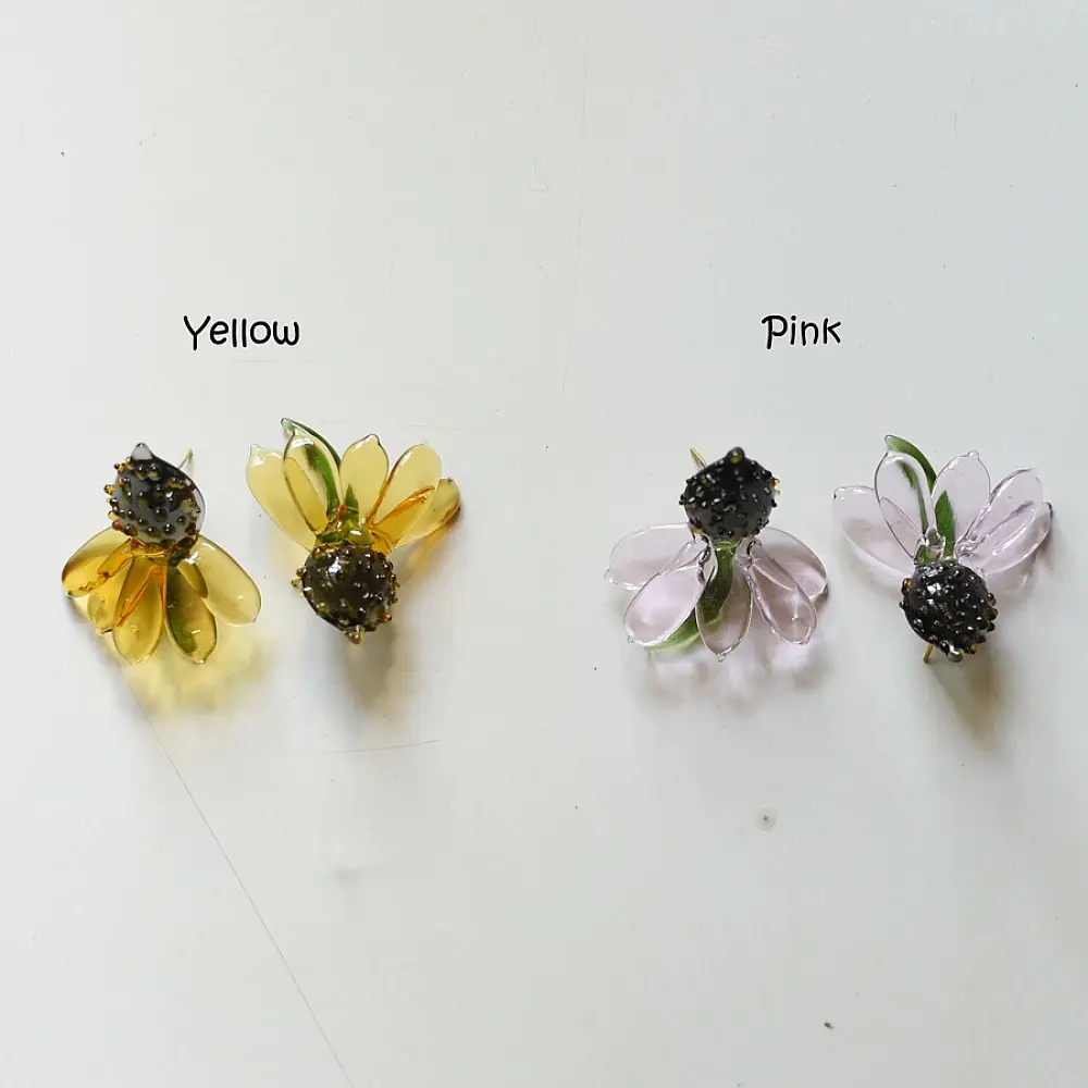 handcrafted translucent amber yellow glass sunflower stud earrings featuring a textured dark beaded center cap