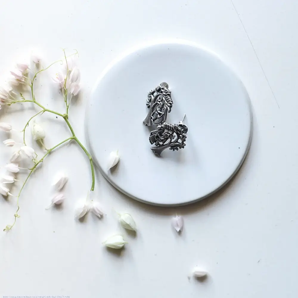 handcrafted german silver radha krishna stud earrings featuring divine figures beneath a branching kadamba tree canopy in oxidised antique finish