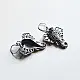 handcrafted german silver ganesha drop earrings featuring a sculpted elephant head motif, intricate ear filigree, trunk detail, and oxidised antique finish