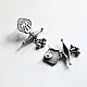 handcrafted german silver trishul stud earrings featuring lord shiva sacred trident motif, central damru drum detail, and oxidised antique finish