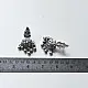 handcrafted german silver floral cluster stud earrings featuring a stone-studded blossom, textured leaf branch, and ruby red inlays