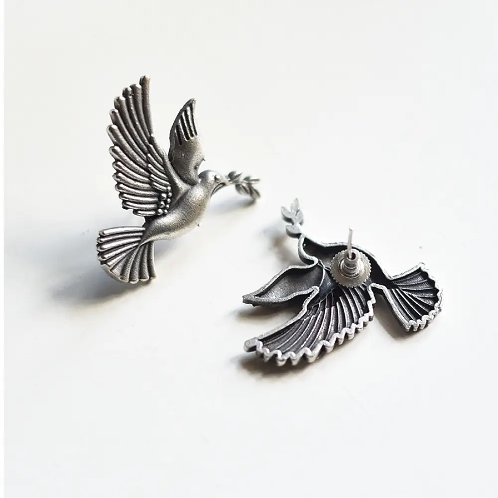 handcrafted german silver bird stud earrings featuring finely detailed spread wings, oxidised finish, and ethnic tribal jewelry design