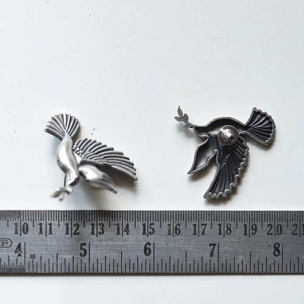 handcrafted german silver bird stud earrings featuring finely detailed spread wings, oxidised finish, and ethnic tribal jewelry design