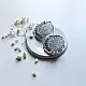 handcrafted german silver circular mandala stud earrings featuring intricate filigree work, scalloped edges, and dangling white pearl ghungroos
