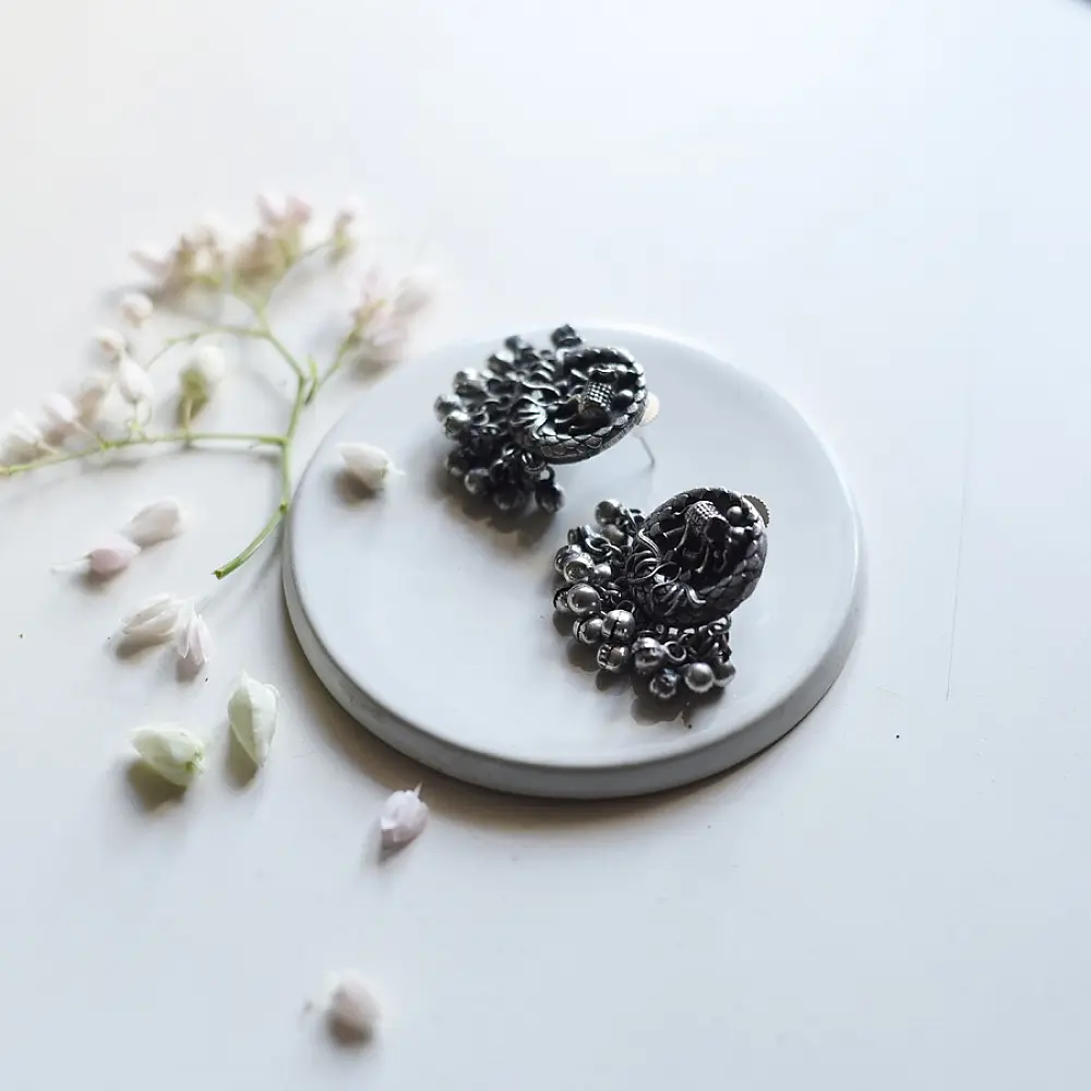 handcrafted german silver jhumka drop earrings featuring elephant motif, filigree stud, dome jhumka, and ghungroo bead fringe