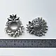 handcrafted german silver lotus motif stud earrings featuring a textured circular centerpiece, radiating petal border, crown leaf crest, and dangling pearl ghungroos