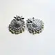 handcrafted german silver lotus motif stud earrings featuring a textured circular centerpiece, radiating petal border, crown leaf crest, and dangling pearl ghungroos