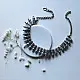 handcrafted german silver choker necklace featuring textured pinecone drop units, beaded collar band, and oxidised antique finish