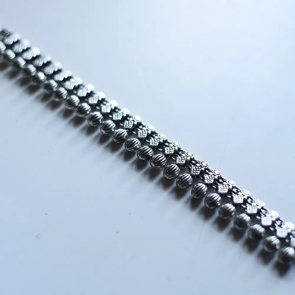 handcrafted german silver dual line choker necklace featuring textured ribbed spherical beads and diamond drop charms in oxidised finish