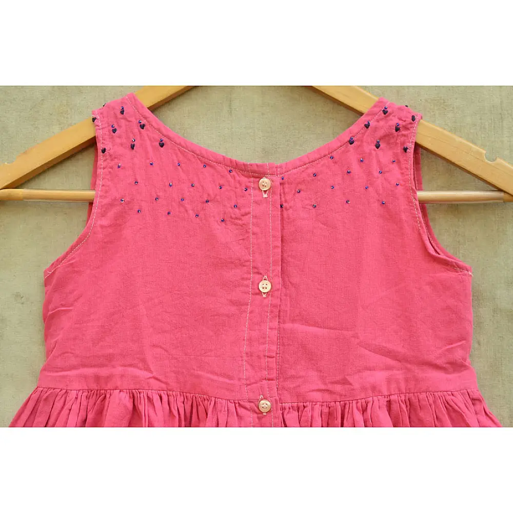 pink pure cotton girls frock with delicate hand embroidered motifs and a gathered skirt