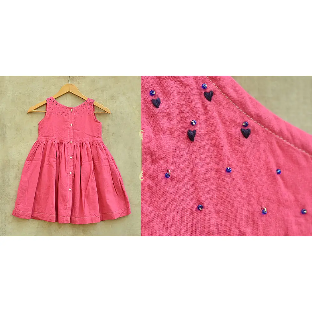 pink pure cotton girls frock with delicate hand embroidered motifs and a gathered skirt