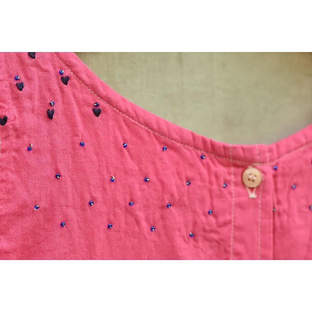 pink pure cotton girls frock with delicate hand embroidered motifs and a gathered skirt