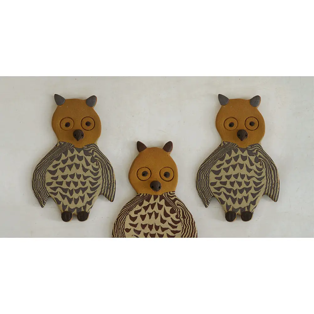 handmade terracotta clay owl fridge magnet with tan head and etched feather pattern body