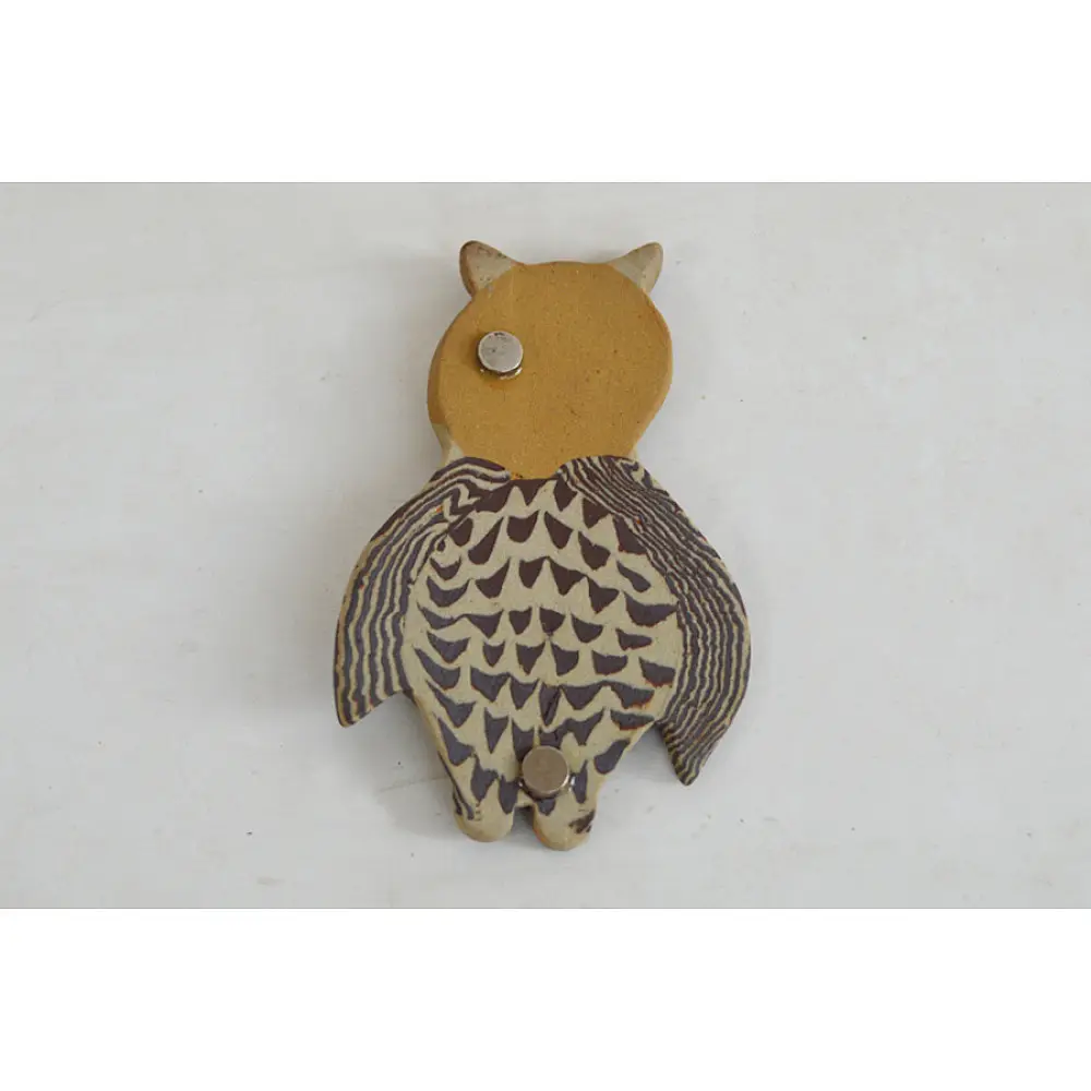 handmade terracotta clay owl fridge magnet with tan head and etched feather pattern body