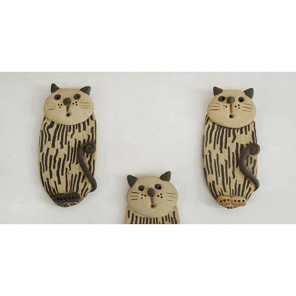 handmade terracotta clay cat fridge magnet with striped body texture and 3D ears and whiskers