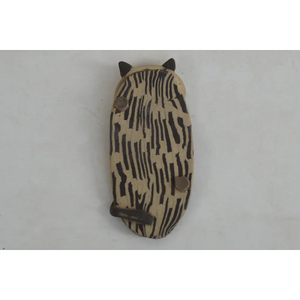 handmade terracotta clay cat fridge magnet with striped body texture and 3D ears and whiskers