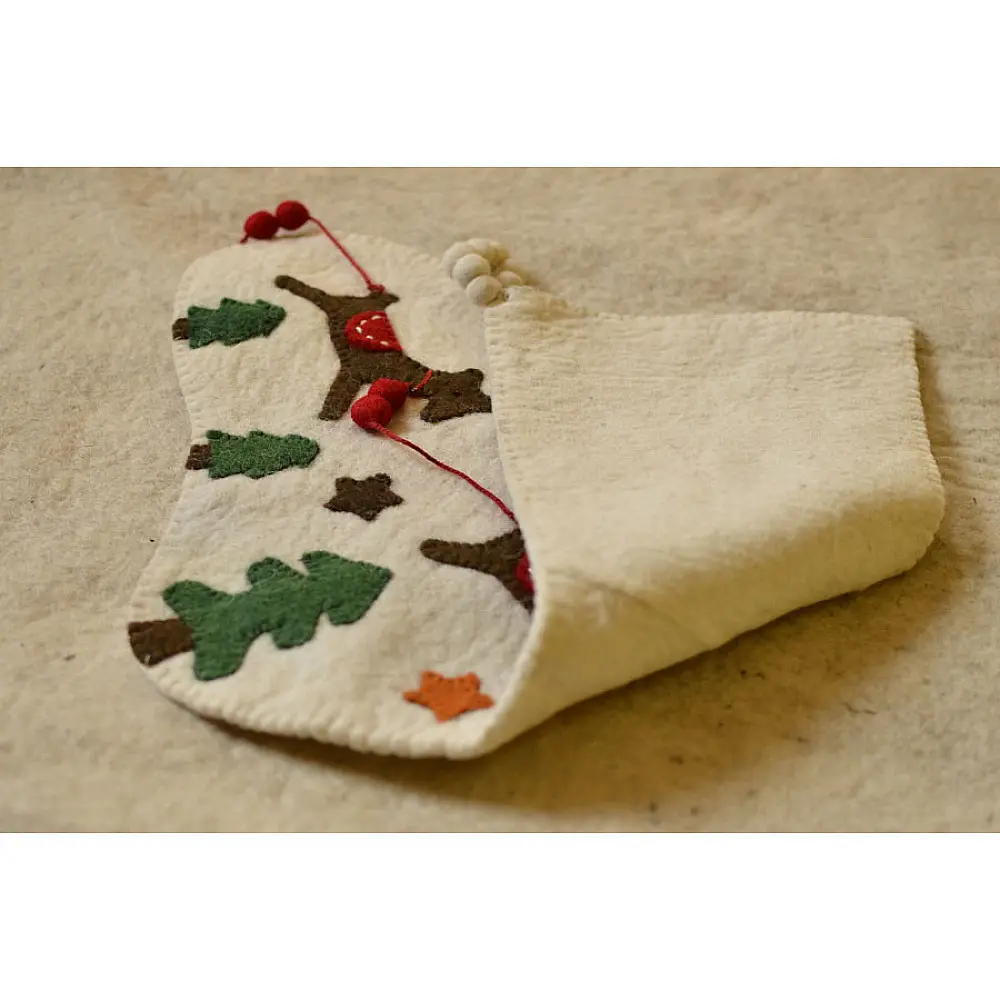cream felt Christmas stocking candy sock featuring handcrafted green holly leaves and red berry accents