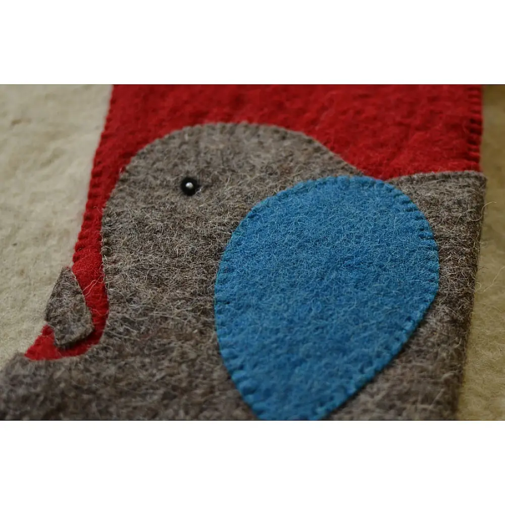 red felt Christmas stocking candy sock featuring a handcrafted grey and blue elephant patch