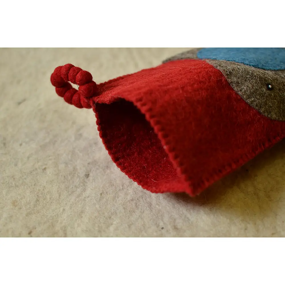 red felt Christmas stocking candy sock featuring a handcrafted grey and blue elephant patch