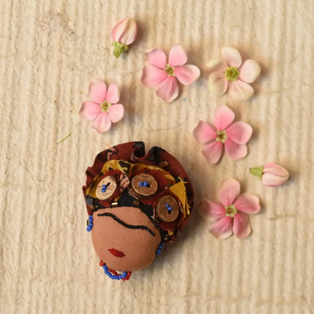 handmade frida kahlo portrait textile brooch pin with oversized upcycled floral hair crown bead details lapel badge gaatha