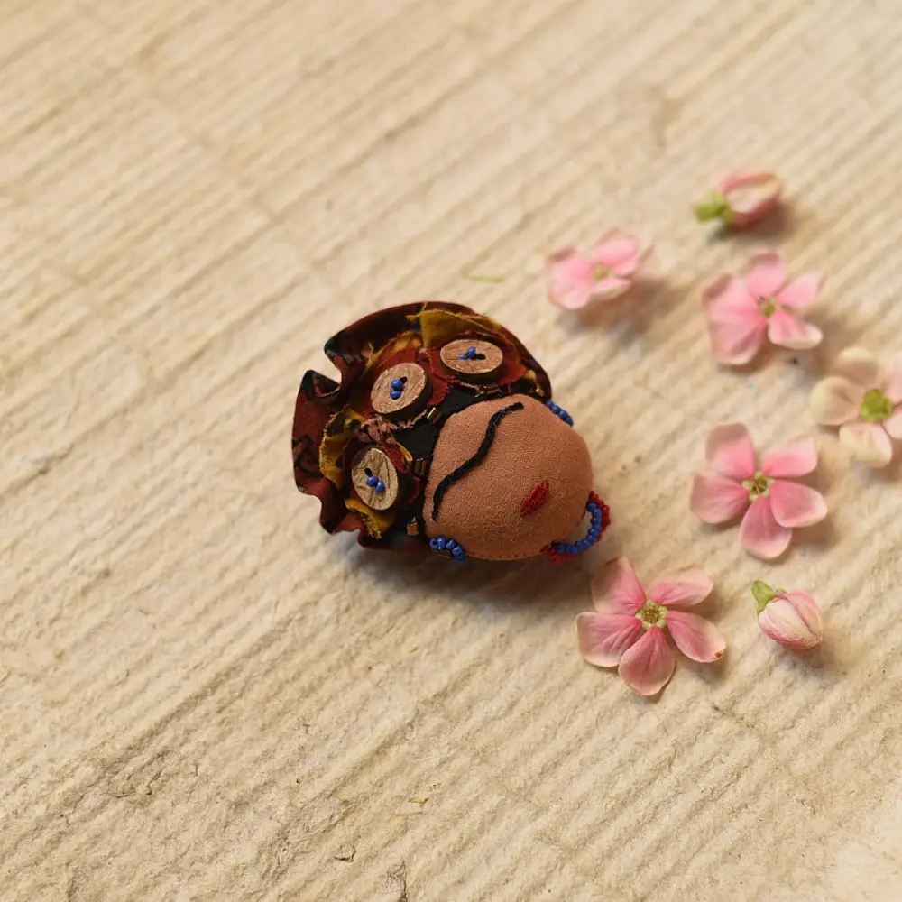 handmade frida kahlo portrait textile brooch pin with oversized upcycled floral hair crown bead details lapel badge gaatha