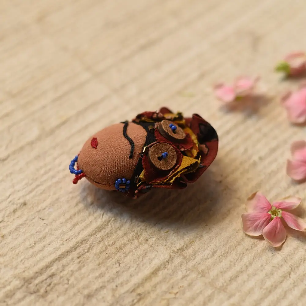 handmade frida kahlo portrait textile brooch pin with oversized upcycled floral hair crown bead details lapel badge gaatha