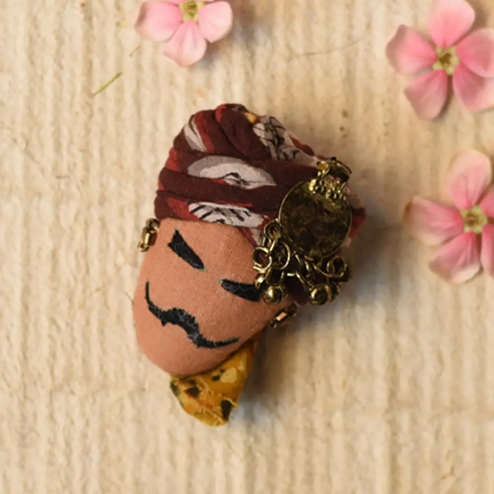 maldhari man hand embroidered fabric brooch pin with traditional patterned turban metallic ring earrings mustache details lapel badge gaatha
