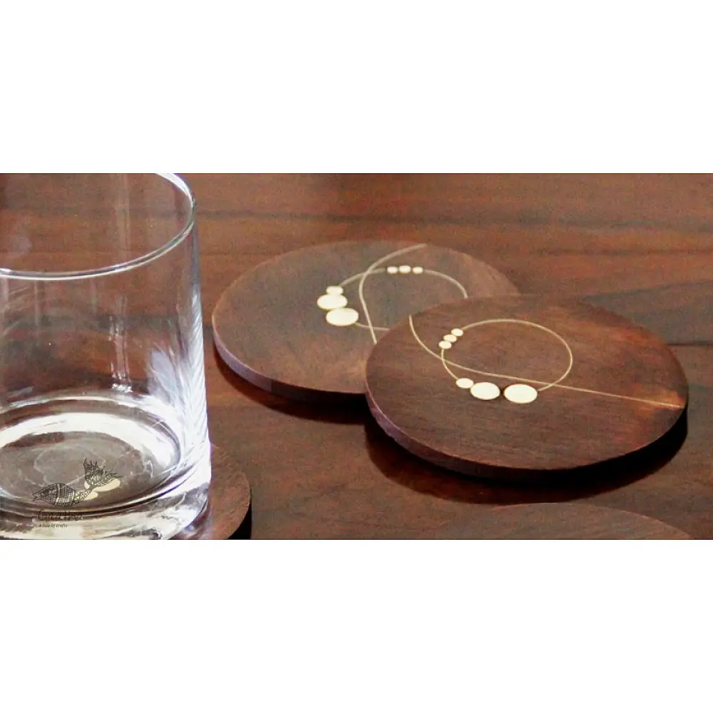 handmade round dark wood coasters set of four with brass wire and dot inlay nathni pattern taarkashi work