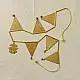 handmade brass triangle design toran door hanging featuring pennant shaped brass flags linked on a brass chain with central floral pendant drop   