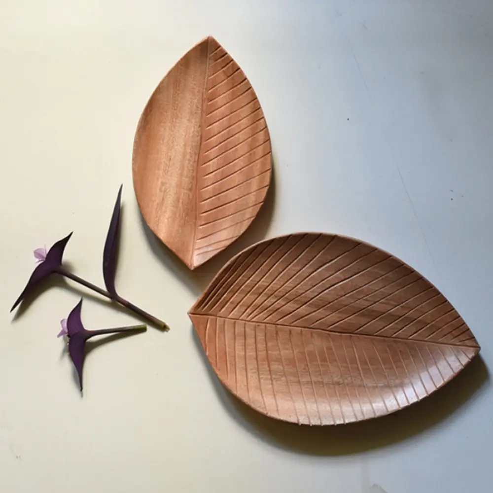 handmade wooden leaf shaped platters set of two with carved vein texture