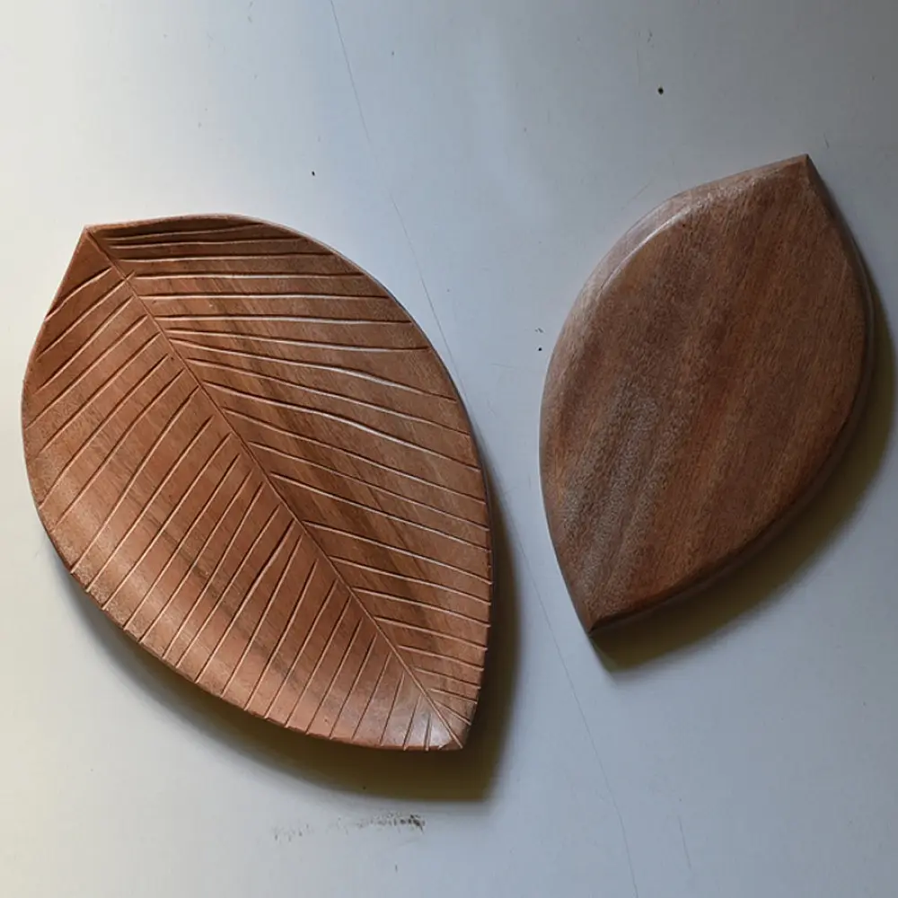 handmade wooden leaf shaped platters set of two with carved vein texture