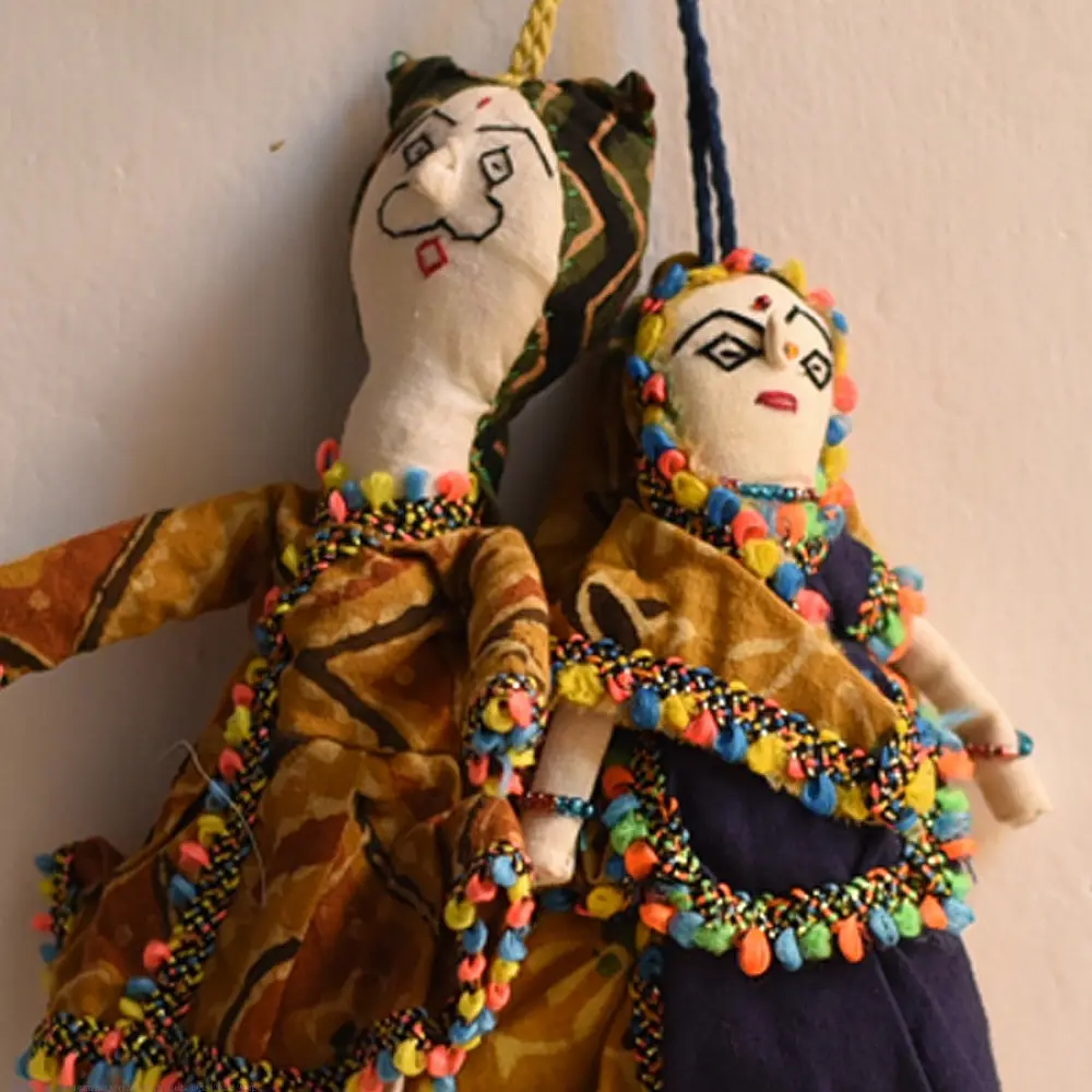 handcrafted traditional kutchi cloth dolls in deep blue and gold ethnic outfits with mirror work embroidery