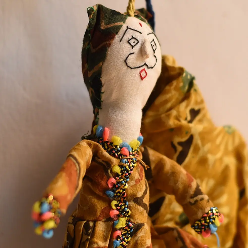 handcrafted traditional kutchi cloth dolls in deep blue and gold ethnic outfits with mirror work embroidery