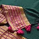 handloom pure cotton saree in deep forest green with contrasting magenta pink striped zari border and handcrafted tassels on pallu