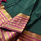 handloom pure cotton saree in deep forest green with contrasting magenta pink striped zari border and handcrafted tassels on pallu