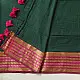 handloom pure cotton saree in deep forest green with contrasting magenta pink striped zari border and handcrafted tassels on pallu